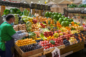 Assortment of fresh organic vegetables and fruits at the farmers market, abstract salesman, farmer....