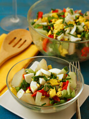 Potatoes salad with veggies and eggs.