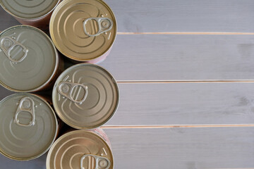 Tin cans of food. Several aluminum cans with long-term storage. View from above.