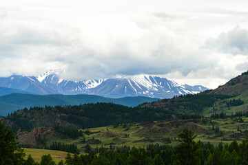 Obraz premium snow caps of mountain peaks in the distance