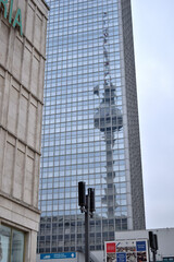 the television tower in Berlin (Berliner Fernsehturm) mirrored in the glass facade of a modern hotel - Alexanderplatz, Berlin, East Berlin, Berlin Mitte, Germany (Deutschland)