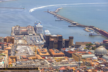 Aerial view of the harbor coast with the medieval Castel Nuovo, Naples, Italy
