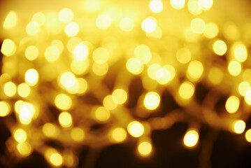 Golden colored blurred background. Abstract background with bokeh.