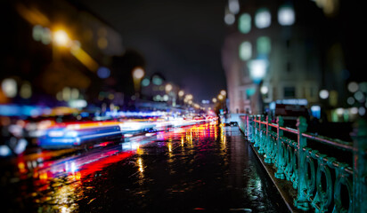 colorful traffic in the city on rainy night - obrazy, fototapety, plakaty