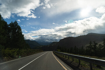 road, mountains, clouds and sky