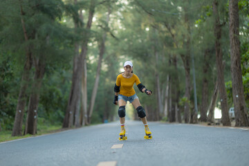 Asian female playing roller skate on the road.