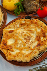 Traditional fried pies from Romania with potatoes, cheese and cabbage. Romanian food.