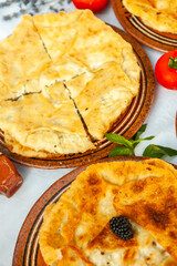 Traditional fried pies from Romania with potatoes, cheese and cabbage. Romanian food.