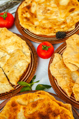 Traditional fried pies from Romania with potatoes, cheese and cabbage. Romanian food.