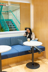 Brunette woman working from her workspace