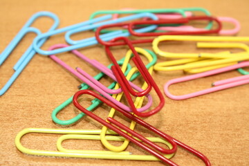 multicolor paper clips on office desk