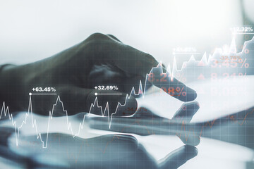 Abstract creative financial graph with finger clicks on a digital tablet on background, forex and...