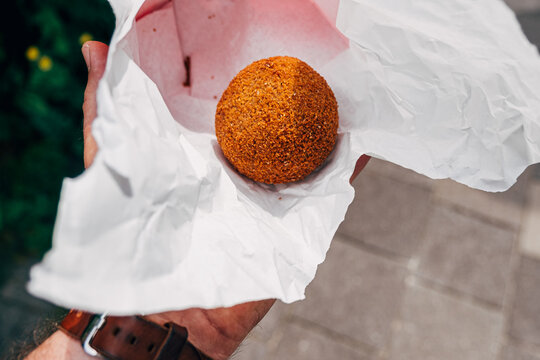 hand holding Eierbal from Netherlands, UNESCO world cultural heritage