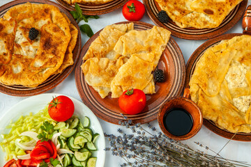 Traditional fried pies from Romania with potatoes, cheese and cabbage. Romanian food.