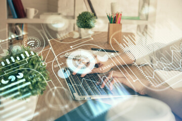 Double exposure of woman hands typing on computer and technology theme drawing. High Tech concept.