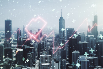 Double exposure of abstract virtual heart rate hologram on Chicago city skyscrapers background. Healthcare technolody concept