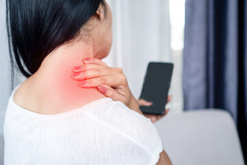 woman suffering from neck , shoulder pain using mobile phone too long with bad posture , internet addiction concept - obrazy, fototapety, plakaty