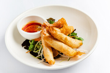 spring rolls with sauce and salad