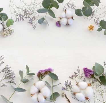 Top view image of flowers composition on white background .Flat lay