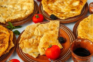 Traditional fried pies from Romania with potatoes, cheese and cabbage. Romanian food.