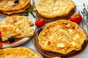 Traditional fried pies from Romania with potatoes, cheese and cabbage. Romanian food.