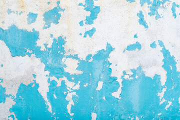 Old blank blue grunge ripped torn wall. Crumpled blue painting background. Wall empty space for text.