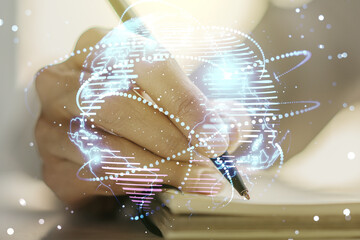 Abstract graphic digital world map with connections and woman hand writing in diary on background,...
