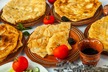 Traditional fried pies from Romania with potatoes, cheese and cabbage. Romanian food.