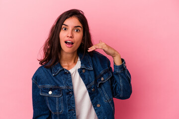 Young caucasian woman isolated on pink background laughing about something, covering mouth with hands.