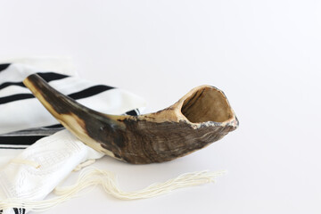 religion image of shofar (horn) on white prayer talit. Rosh hashanah (jewish New Year holiday), Shabbat and Yom kippur concept