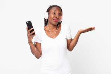 feeling puzzled and confused and doubting with headphones and a smart phone