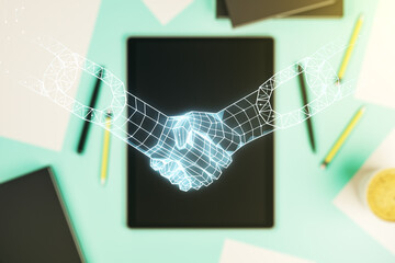 Double exposure of blockchain technology with handshake hologram and digital tablet on background, top view. Research and development decentralization software concept