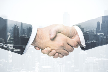 Fototapeta na wymiar Double exposure of handshake two businessmen on modern skyscrapers background, research and strategy concept