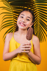 Portrait of a cute little girl holding a chocolate popsicle stick.