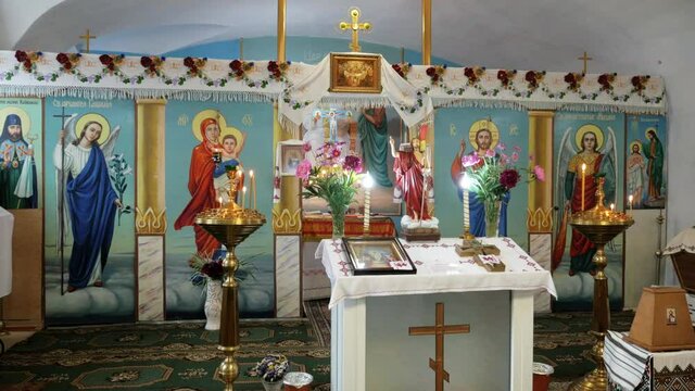 Ancient Ukrainian church, cathedral. Icons. Iconostasis, paintings and drawings on the wall.