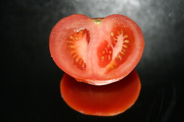 tomato on black background