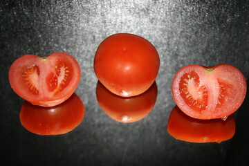 tomato on black background