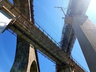 Three railway bridges against the blue sky