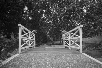 white bridge, colorless photo taken in a park
