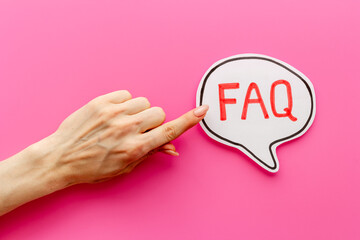 Hands with faq - frequently asked questions - text on paper bubble