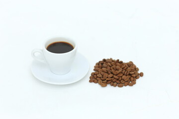 Coffee cup and beans on a white background.