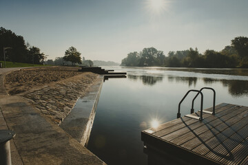 place for people meeting or gathering place in a city on a river with wooden platform and handrails