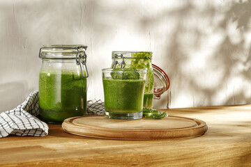 Fresh green smoothie on wooden desk and free space for your decoration 