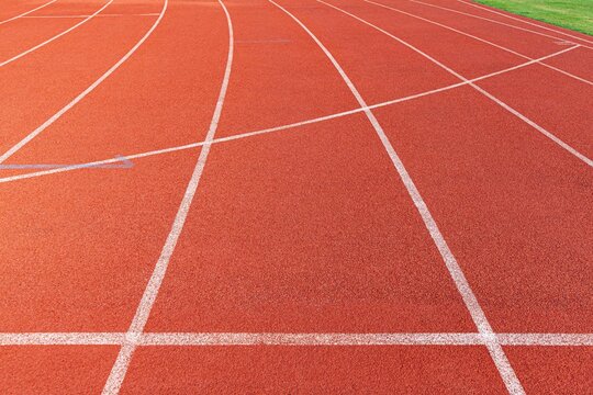 The curved lane in running track or athlete track in stadium. Running track is a rubberized artificial running surface for track and field athletics