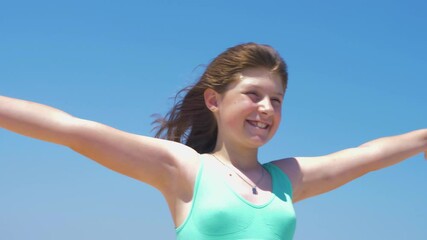 young girl with hair blown by the wind 