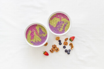 Colorful chia pudding in bowles for breakfast. Acai smoothies bowles