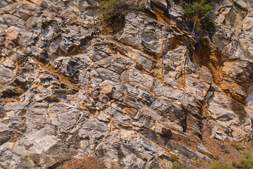 Sharp gray rocks on Mediterranean seaside, Greece