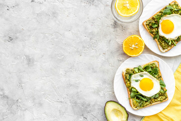 Sandwich with eggs avocado cream and spinach, top view