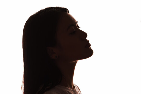 Portrait silhouette profile of asian woman on white background.