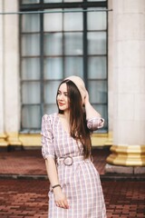  brunette girl with long hair. street style. Girl in coat